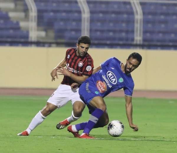 علي الزقعان (على اليمين)